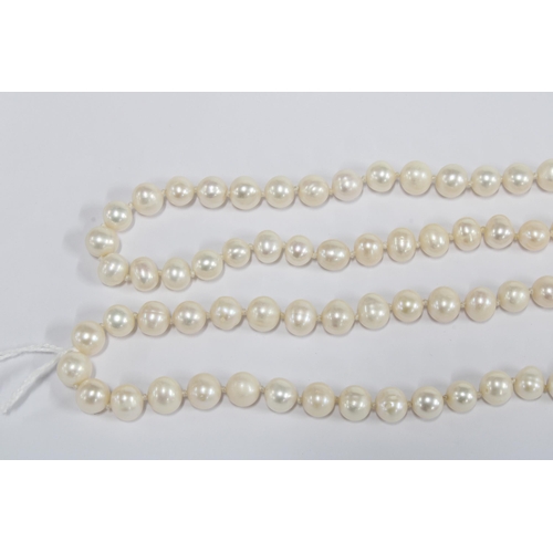 22 - An opera length strand of cultured pearls