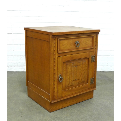 228 - Oak bedside cabinet with linen fold pattern, 52 x 70 x 50cm.