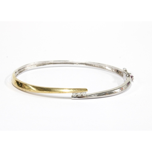 23 - 9ct yellow and white gold diamond set bangle, stamped 375