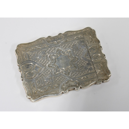 26 - Victorian silver card case with an allover engraved foliate pattern and vacant cartouche, 10 x 7cm