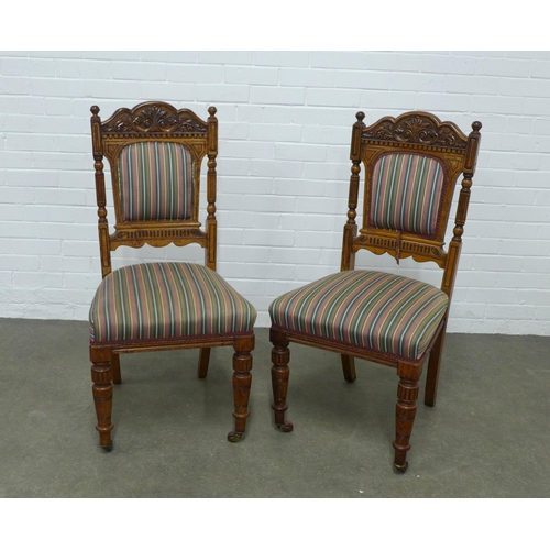 266 - Pair of oak side chairs,  carved top rails and striped upholstery, 49 x 102 x 47cm. (2)