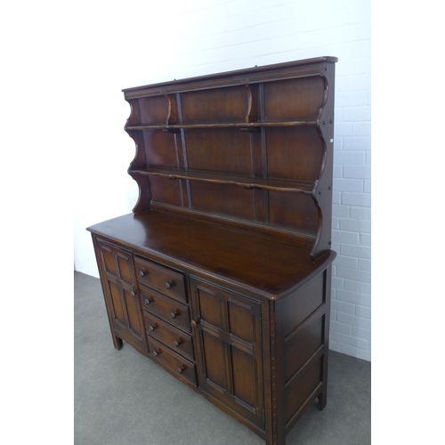 281 - A vintage dark elm Ercol style dresser, 146 x 170 x 50cm.