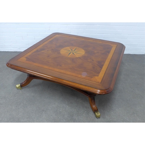 283 - Large mahogany coffee table with star motif and undertier, 122 x 43cm.