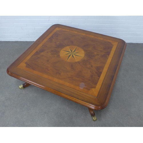 283 - Large mahogany coffee table with star motif and undertier, 122 x 43cm.