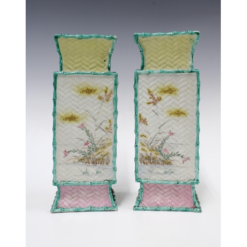 301 - Pair of chinoiserie vases, relief decorated panels with flowers and rabbits and a basket weave patte... 