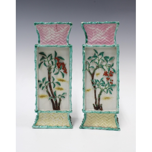 301 - Pair of chinoiserie vases, relief decorated panels with flowers and rabbits and a basket weave patte... 