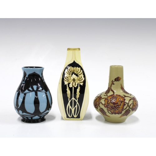 303 - Two small Moorcroft art nouveau pattern vases, 10cm together with a Black Ryden vase, 13cm (3)