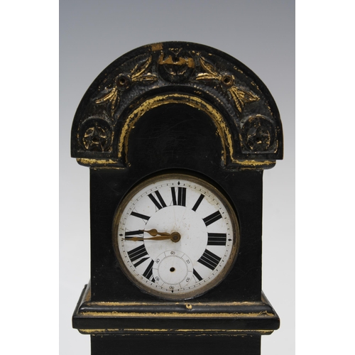 305 - Miniature gilt and ebonised grandfather clock, containing a pocket watch, 21cm