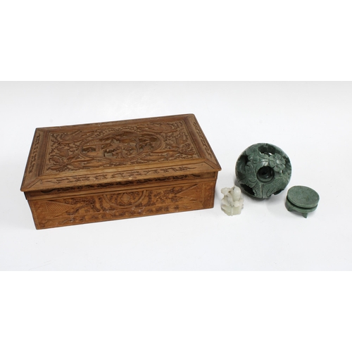 317 - Carved wooden box, 30 x 18cm, together with a carved hardstone puzzle ball and stand and a jadeite f... 