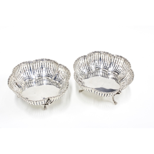 33 - A pair of George V silver bonbon dishes of circular lobed form with three scroll feet,  Birmingham  ... 