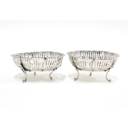 33 - A pair of George V silver bonbon dishes of circular lobed form with three scroll feet,  Birmingham  ... 