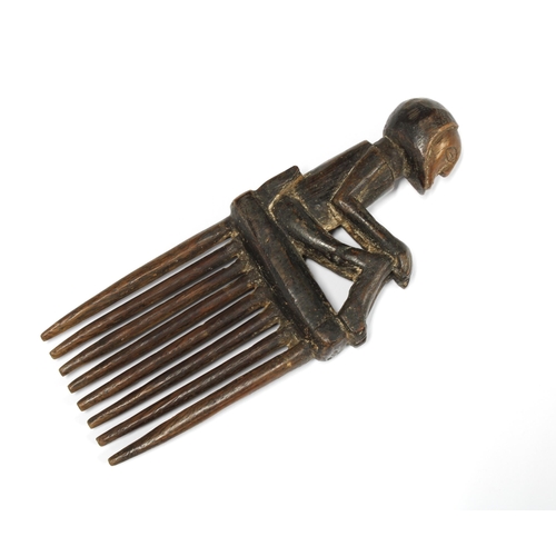 331 - CHOKWE wooden comb with a seated figure terminal, 20cm