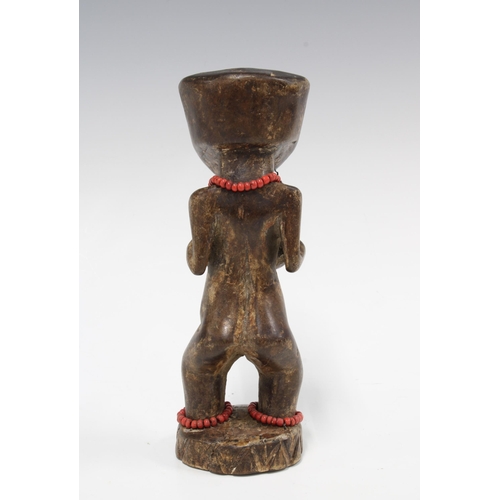 332 - LWENA carved wooden female figure with beads, 21cm