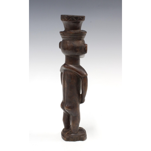 337 - OVIMBUNDU, a front and back carved male figure, 31cm