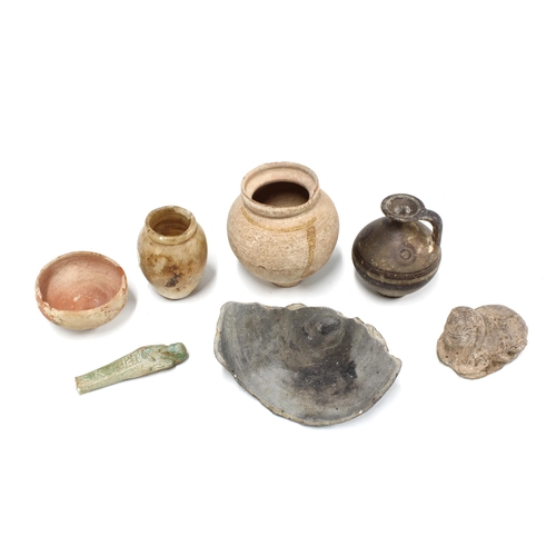 340 - A collection of antiquities to include an ancient Egyptian alabaster vessel, shabti, miniature Cypri... 