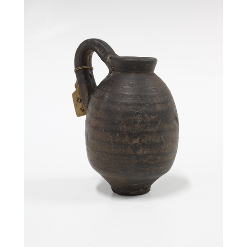 341 - Ancient juglet, CA 4th century BC, with collectors label dated 1918, 10cm high