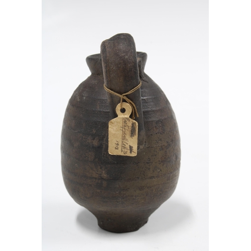 341 - Ancient juglet, CA 4th century BC, with collectors label dated 1918, 10cm high