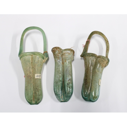 345 - Three Roman unguentarium glass vessels, CA 2nd / 3rd century AD, 17cm (3)