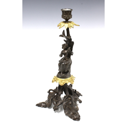 379 - Bronze patinated metal candlestick with gilt metal leaves