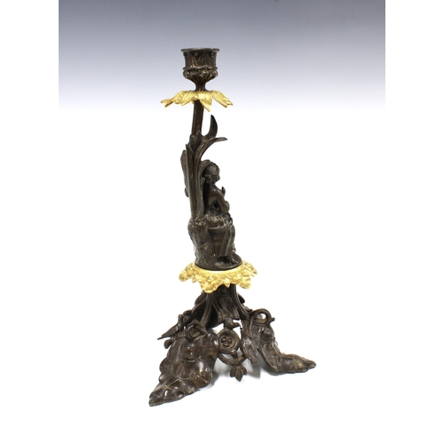 379 - Bronze patinated metal candlestick with gilt metal leaves