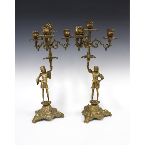 380 - A pair of brass figural candelabra, (2)