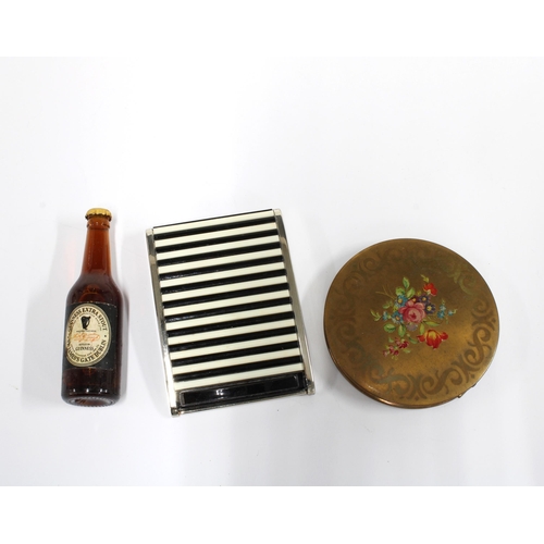 414 - Two vintage powder compacts and a miniature bottle of Stout, with contents (3)