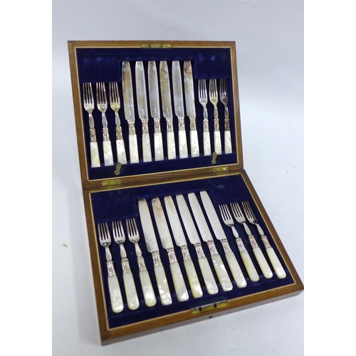 452 - Cased set of twelve mother of pearl and Epns knives and forks