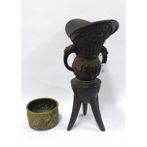 453 - A large Archaic style vessel on tripod stand,62cm (a/f) together with a brass planter (2)