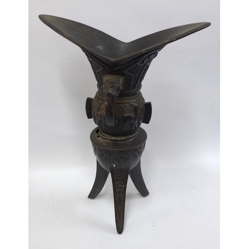 453 - A large Archaic style vessel on tripod stand,62cm (a/f) together with a brass planter (2)