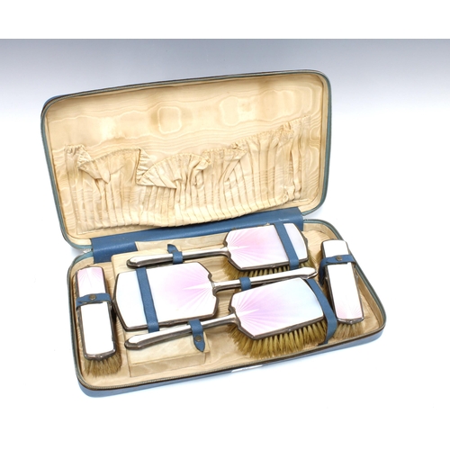 67 - George VI silver backed and enamel dressing table brush set, five parts in fitted case (a/f)