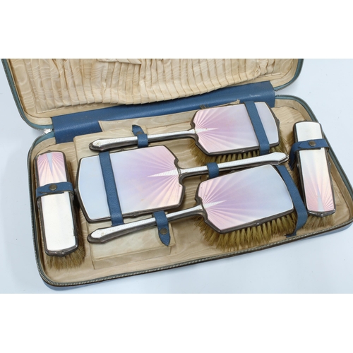 67 - George VI silver backed and enamel dressing table brush set, five parts in fitted case (a/f)