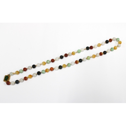 96 - A strand of vintage jade and coloured hardstone beads, the gold clasp with a green jade plaque and s... 