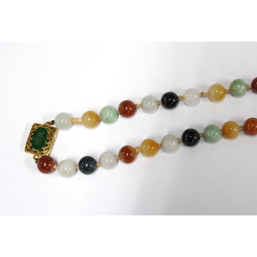 96 - A strand of vintage jade and coloured hardstone beads, the gold clasp with a green jade plaque and s... 