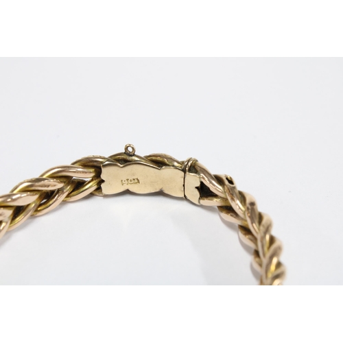 1 - 9ct gold bangle with interwoven links, stamped 9ct