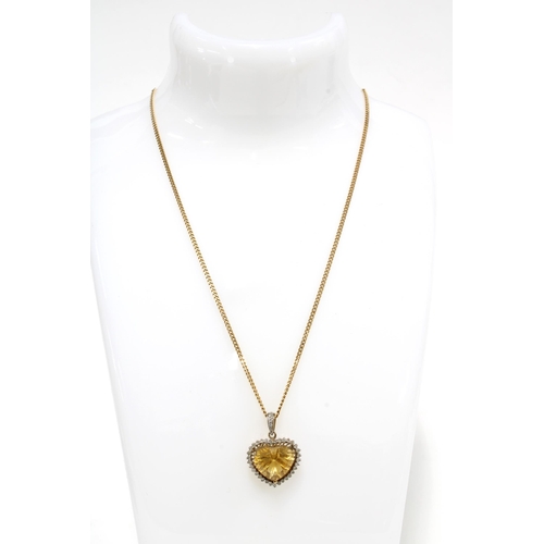 10 - 9ct gold diamond and gemset heart shaped pendant on chain, stamped 375