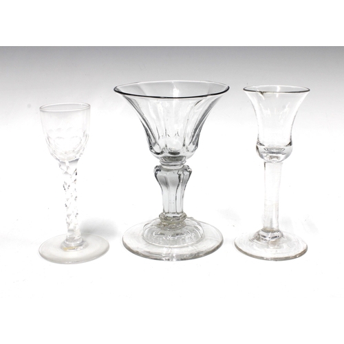 102 - 18th century champagne glass, 15cm, and two wine glasses to include one with a facet cut stem,  (3)