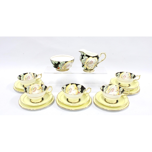 111 - Art Deco Paragon fine bone china tea set, the cups with yellow flowers to a black ground, with pale ... 