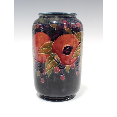 114 - Moorcroft Pomegranate tuble line decorated vase,  green facsimile signature and impressed marks, 21c... 