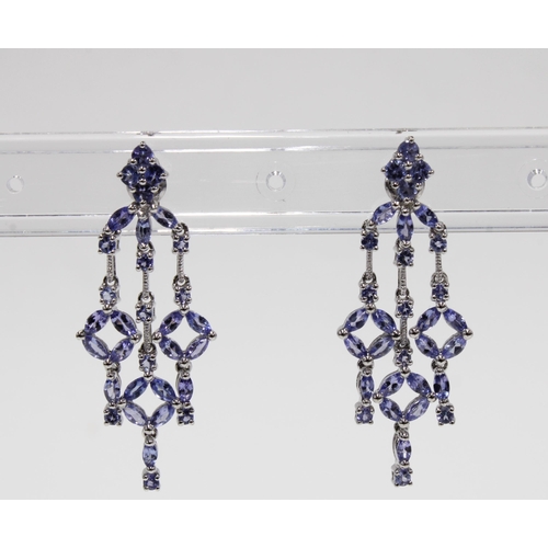 12 - A pair of 9ct white gold gemset drop earrings, stamped 9K