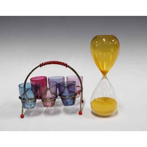 125 - Hourglass sand timer with yellow and clear glass 20cm, together with a a vintage Atomic metal stand ... 