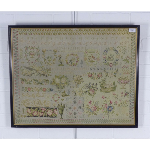 159 - A large pictorial needlework sampler, framed under glass, 72 x 57cm