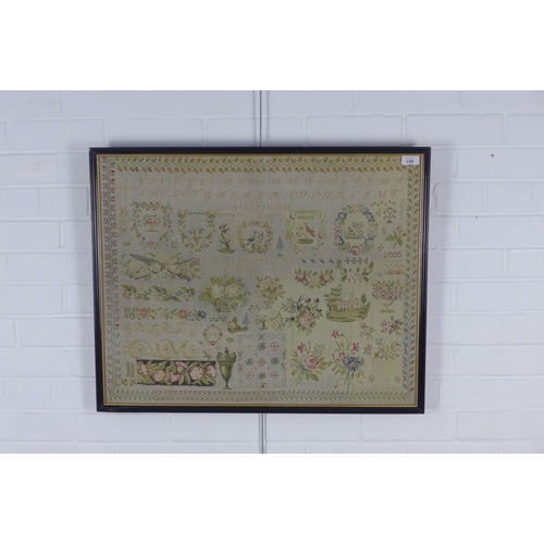 159 - A large pictorial needlework sampler, framed under glass, 72 x 57cm