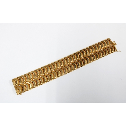 17 - Vintage gold bracelet, believed to be from Venezuela, comprising two rows of textured flat links, wi... 