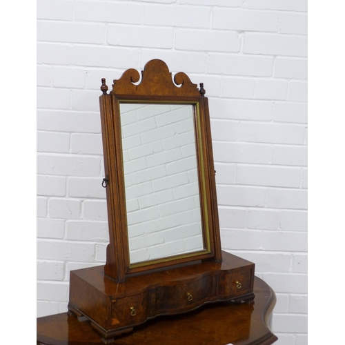 206 - Walnut dressing table mirror with serpentine base, 50 x 71 x 21cm.