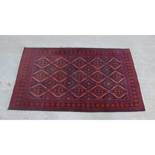 229 - Afghan rug with red field and geometric pattern, 175 x 98cm