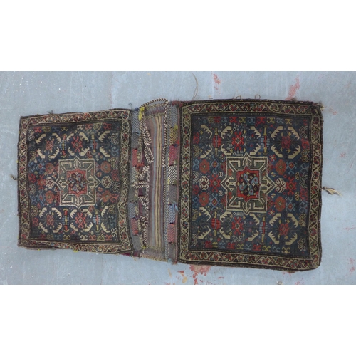 232 - Shahsevan saddlebags, larger 124 x 63cm, together with two smaller Persian saddlebag pieces (4)