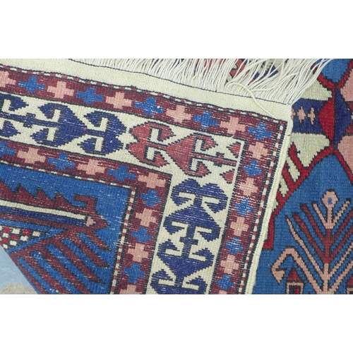 234 - Kazak style rug, blue and red field, 180 x 100cm