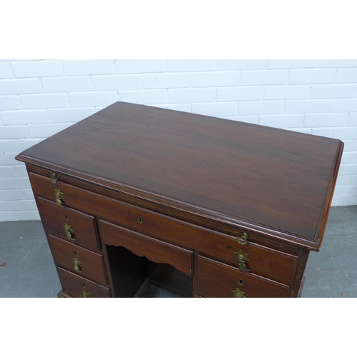 250 - Georgian mahogany kneehole desk, pull out slide over an arrangement of nine drawers, 89 x 80 x 53cm.