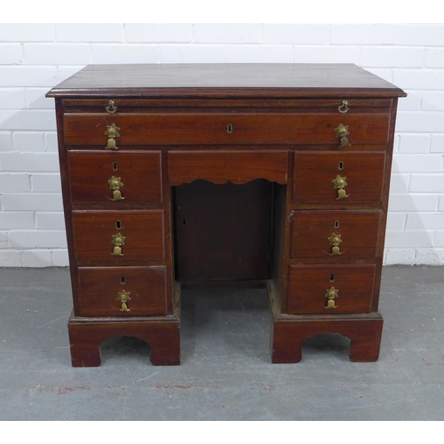 250 - Georgian mahogany kneehole desk, pull out slide over an arrangement of nine drawers, 89 x 80 x 53cm.