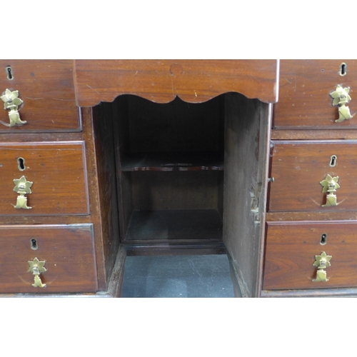 250 - Georgian mahogany kneehole desk, pull out slide over an arrangement of nine drawers, 89 x 80 x 53cm.